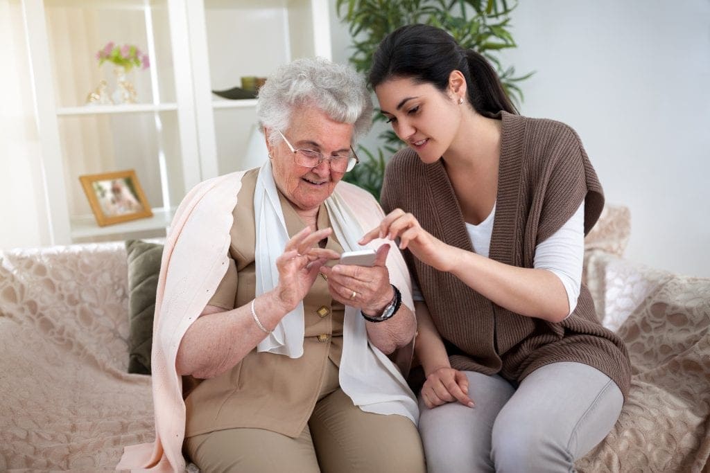 WebBabyShower -   teaching grandmother how to use phone