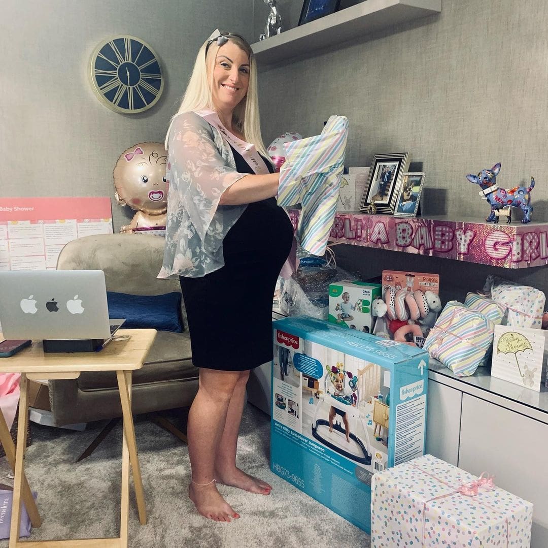 mom opening gifts at virtual baby shower