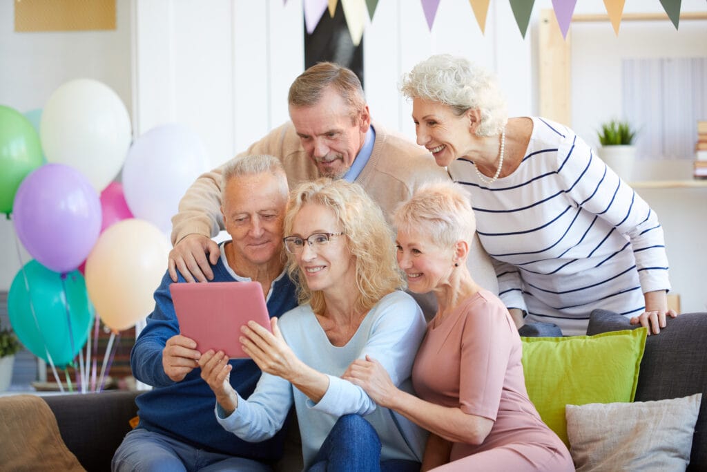 webbabyshower grandparents video chat holding tablet