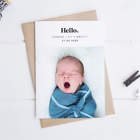 minimal birth announcement with a baby picture and little details